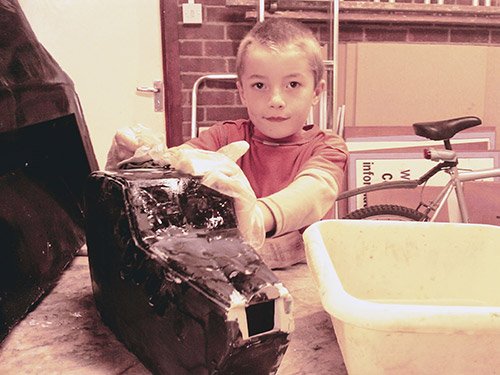 Sanding the unfinshed head to remove the imperfections